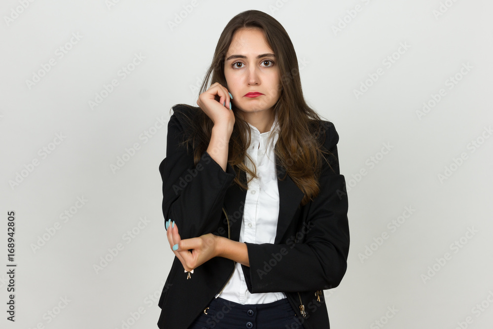 Elbow pain. Beautiful young businesswoman holding her elbow. Elbow pain. Beautiful young businesswoman holding her elbow.