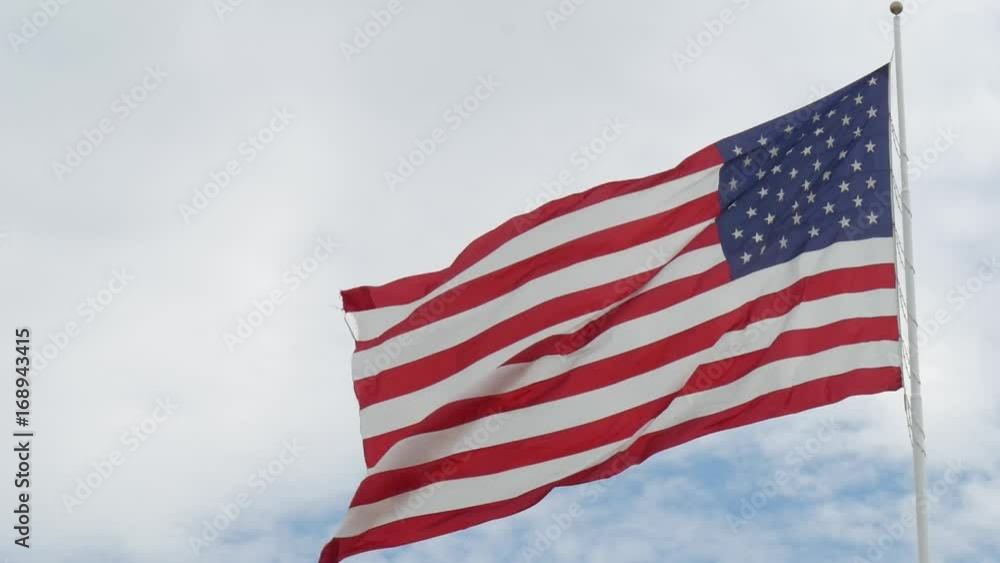 Steady close up shot of a US flag waving gently in the wind Steady close up shot of a US flag waving gently in the wind