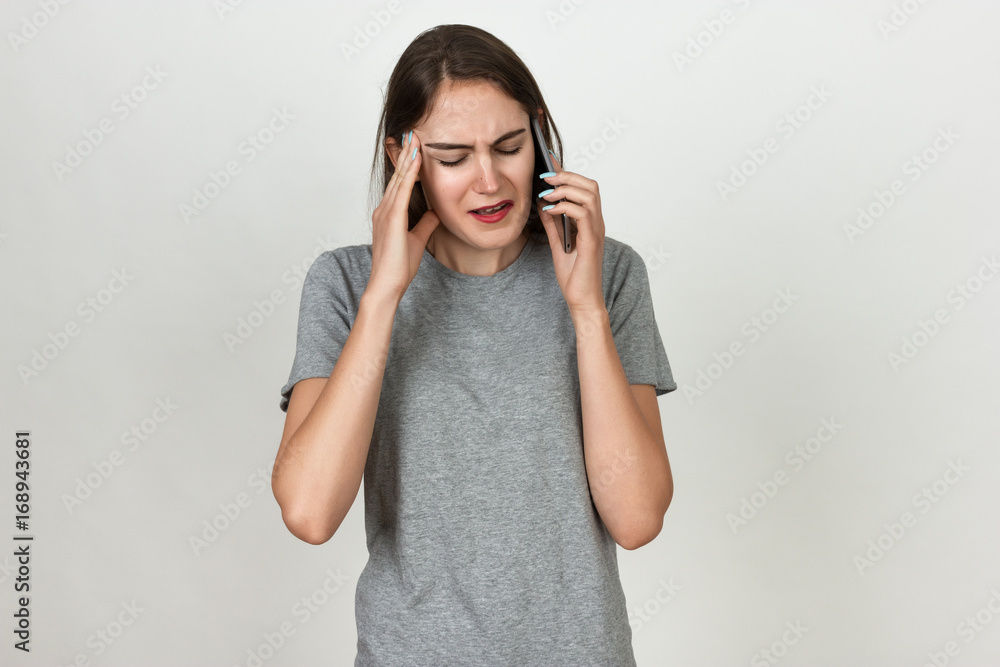 Portrait of a pretty woman stress and headache having migraine pain Portrait of a pretty woman stress and headache having migraine pain