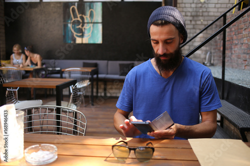 Bearded man with a phone
