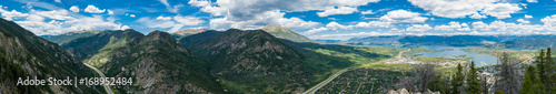 Panorama of mountains, winding highway, and Dillon, Colorado