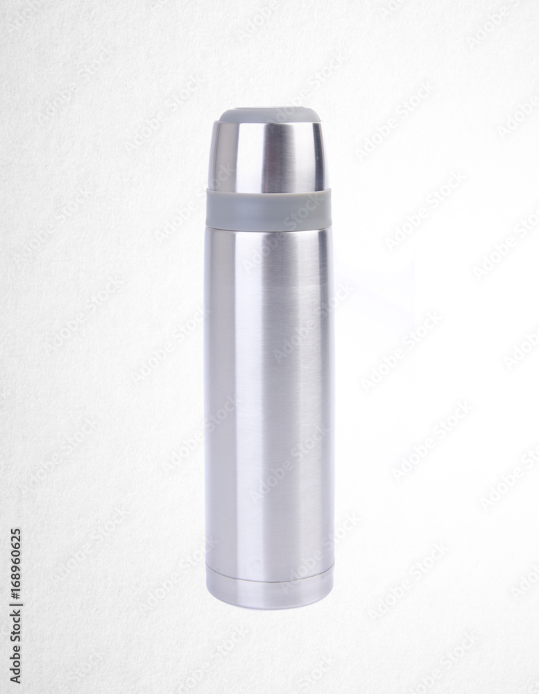 Thermo or Thermo flask from stainless stee on background. Thermo or Thermo flask from stainless stee on background.