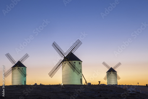 Illuminated traditional windmills at rising