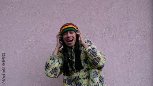 Guy listening to music on headphones.