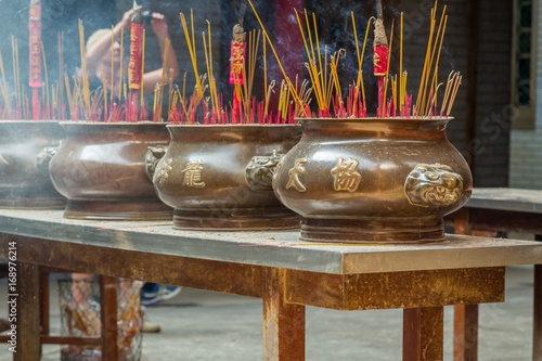 Burining Incense in a Buddhist Temple in Ho Chi Minh City (Saigon) photo