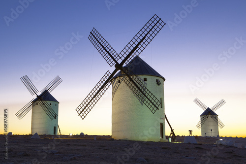 Illuminated traditional windmills at rising