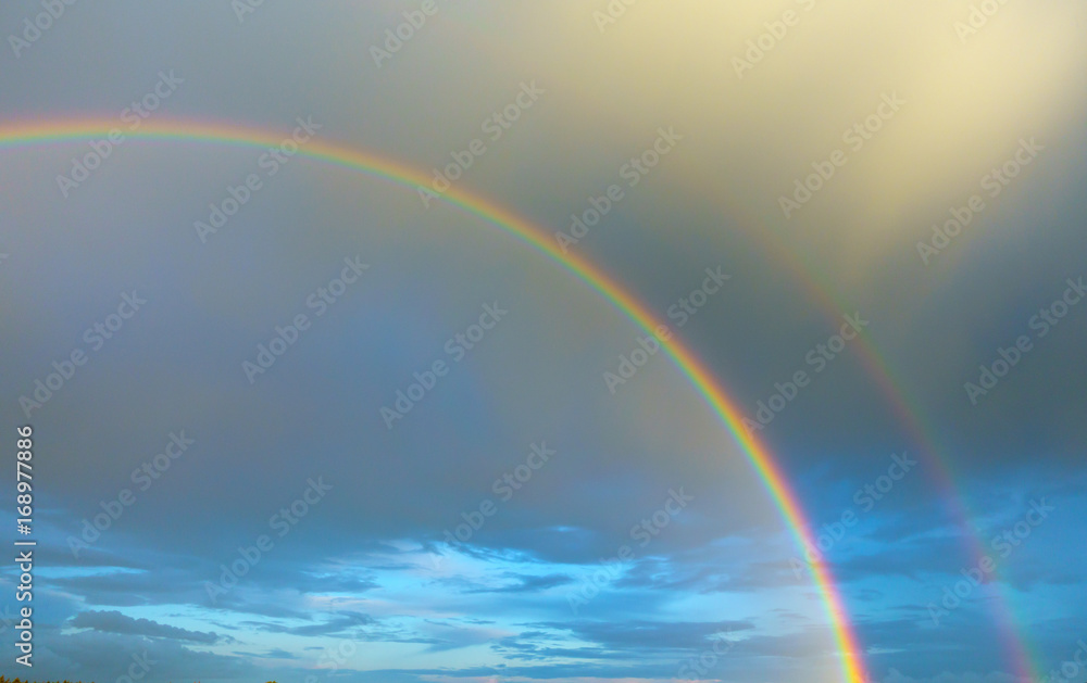 Blue sky with double rainbow Blue sky with double rainbow