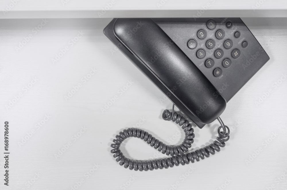 Telephone is placed on document shelf Telephone is placed on document shelf