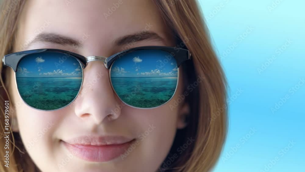 Cinemagraph - Beautiful young girl in the sunglasses . Motion Photo. Cinemagraph - Beautiful young girl in the sunglasses . Motion Photo.