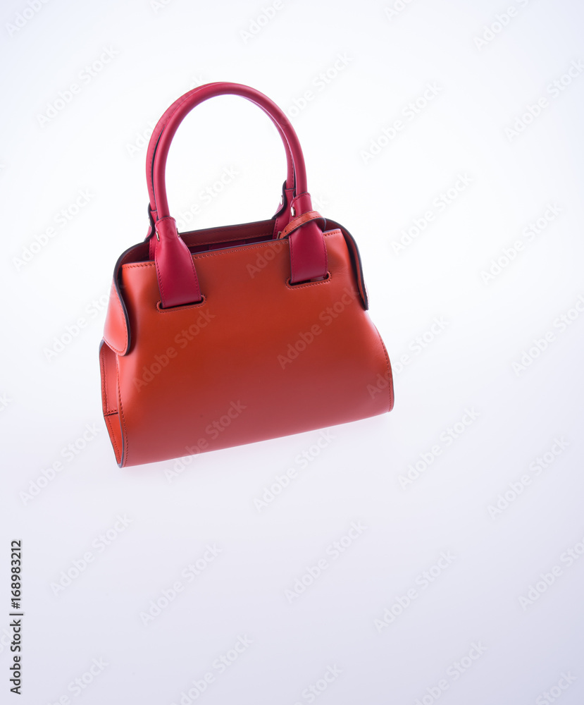bag or brown leather woman handbag on background. bag or brown leather woman handbag on background.