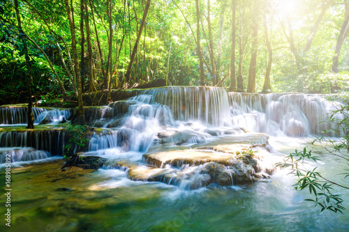water fall with sun shine kanchanaburi thailand