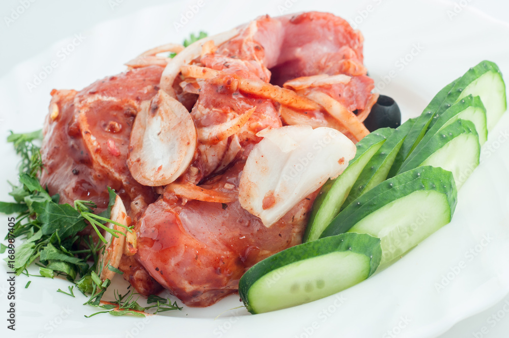 Raw pork beef meat on the white plate Raw pork beef meat on the white plate