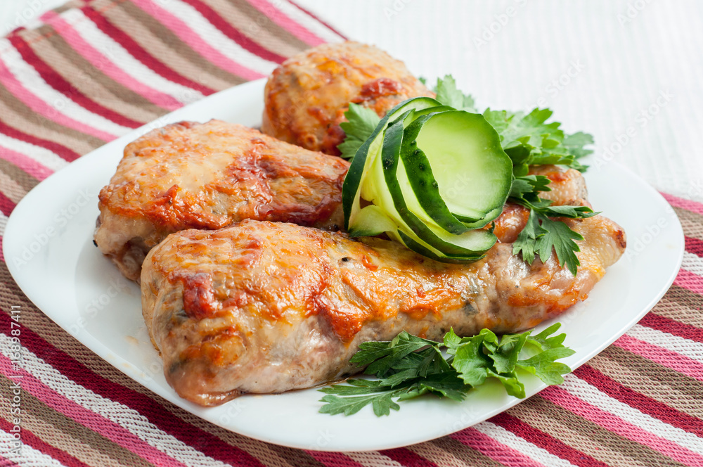 chicken fried legs with vegetables on the plate chicken fried legs with vegetables on the plate