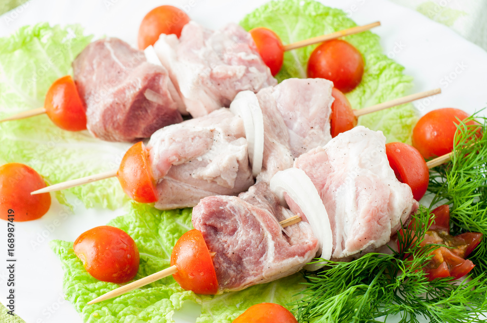 Raw pork beef meat on the white plate Raw pork beef meat on the white plate