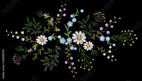 Embroidery trend floral pattern small branches herb daisy with little blue violet flower. Ornate traditional folk fashion patch design neckline blossom on black background vector illustration