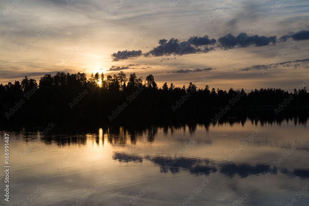 Midnight sun in Lapland.Peaceful lake view. Midnight sun in Lapland.Peaceful lake view.