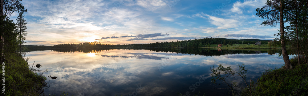 Midnight sun in Lapland.Peaceful lake view. Midnight sun in Lapland.Peaceful lake view.