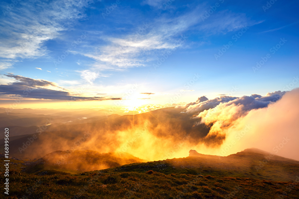 Fototapeta premium Beautiful view from the top of the mountain at sunset.