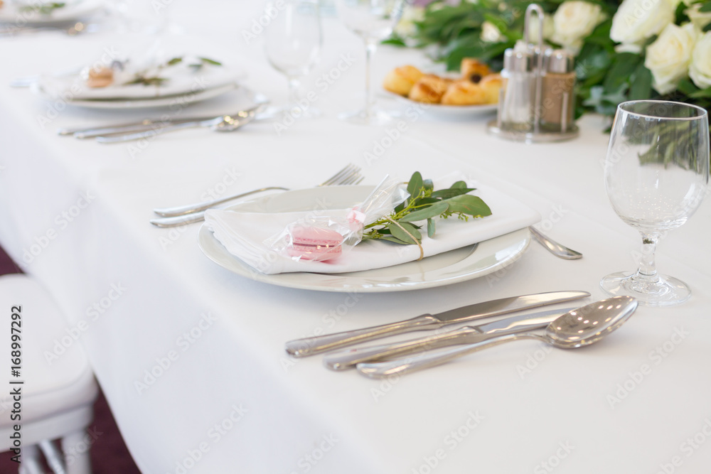 table setting with spoon, knife, plates and glass table setting with spoon, knife, plates and glass