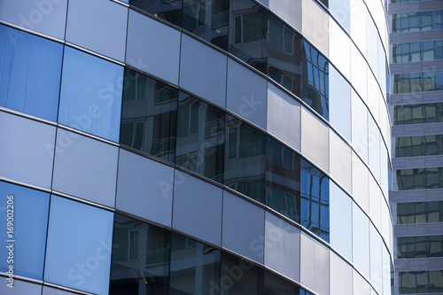 Modern architecture close up with mirror window reflection. Bangkok Thailand