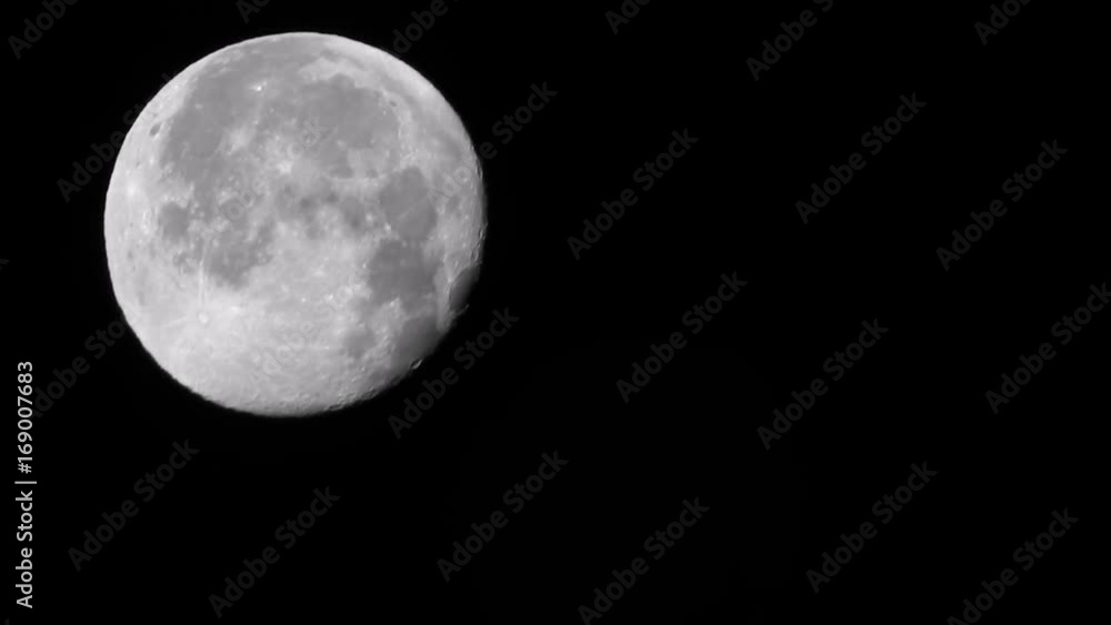 The moon in the black sky slowly moving The moon in the black sky slowly moving