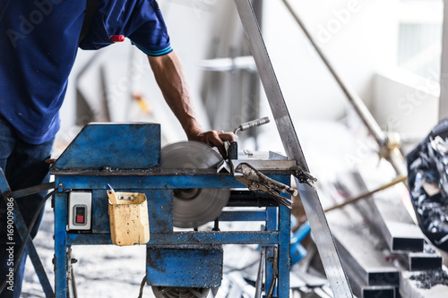industrial equipment men working cutting aluminium