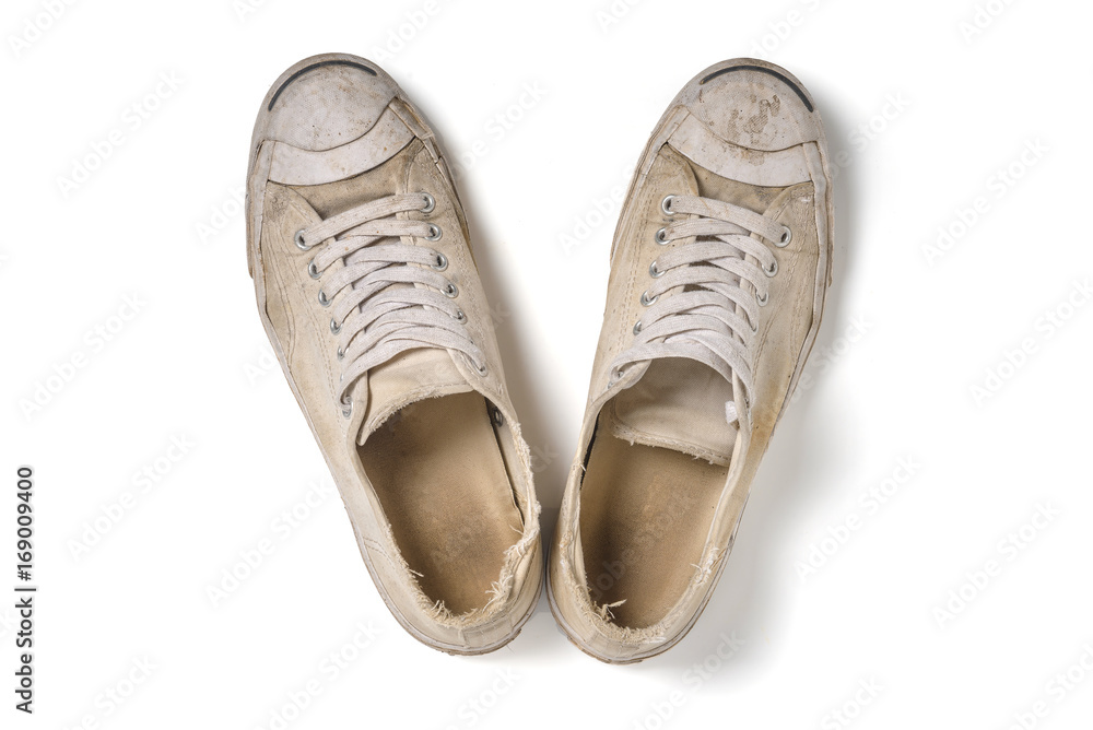 Old white shoes isolate