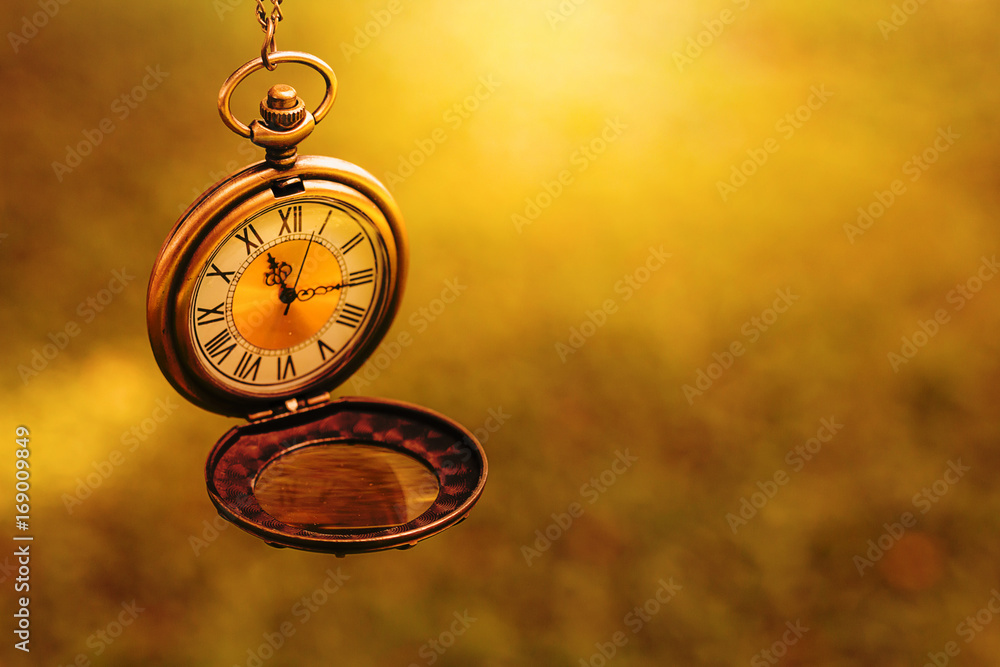 Old retro clock on dark gold color have empty space for insert text and use for graphic resource background texture