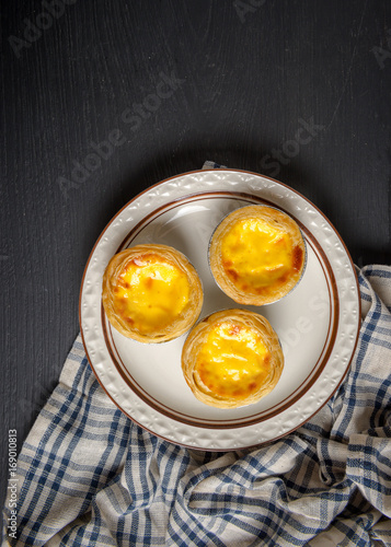 egg tart on black wood