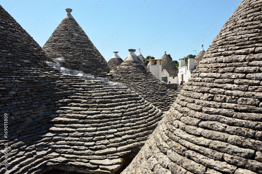 Between trulli roofs the typical old houses in Alberobello, Apulia, Italy