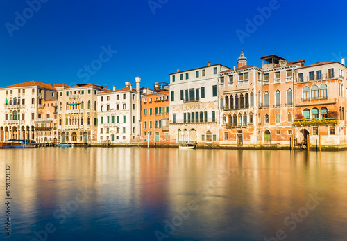 Venice, Italy: Old houses in the traditional Venetian architecture style reflected in the Grand Canal of Venice. Long exposure photo © Travellaggio