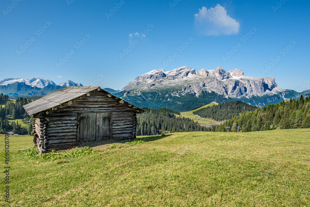 wooden house in mountain landscape of alto adige, italy wooden house in mountain landscape of alto adige, italy