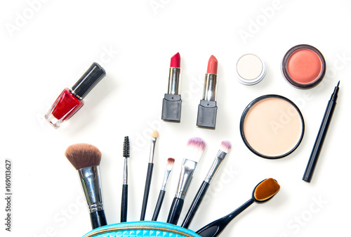 Cosmetics and fashion background with make up artist objects: lipstick, eye shadows, mascara ,eyeliner, concealer, nail polish. Lifestyle Concept