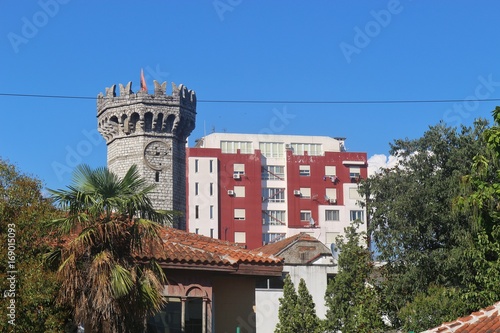 The English tower and high buildings in the center of Shkoder, Albania. Shokder is the third largest city in Albania, located on the border to Montenegro. South-east Europe.