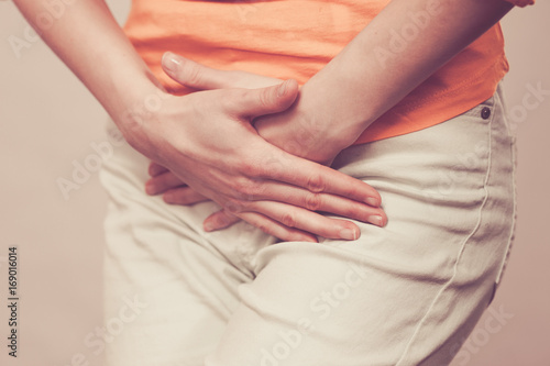 Wallpaper Mural woman with hands holding her crotch Torontodigital.ca