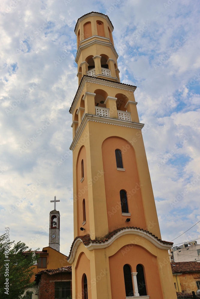 Bell Tower of the Nativity of Christ Albanian Orthodox church in the center of Shkoder, Albania, In the background the clock tower of the Franciscan Church. South-East Europe.