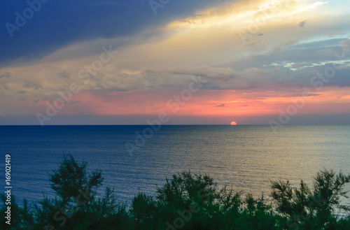 The setting sun over the sea