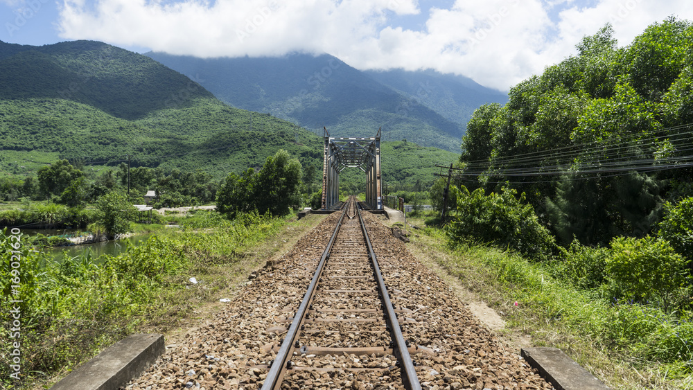 Railway tracks under the mountains of Vietnam.