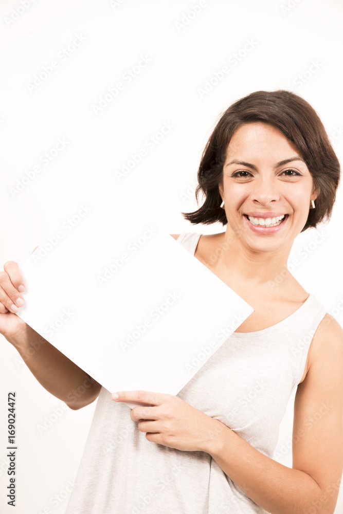 Beautiful young woman holding a blank sheet of paper Beautiful young woman holding a blank sheet of paper