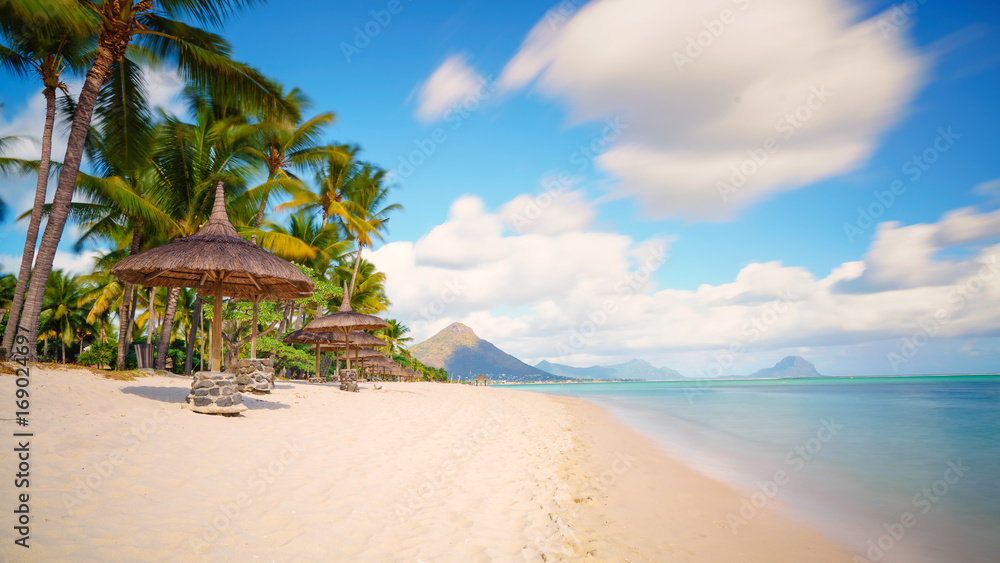 Relaxing on remote Paradise beach,typical tropical beach at Mauritius island.
