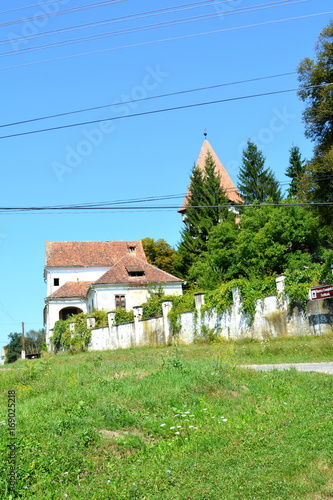 Fortified medieval saxon evangelic church in the village Somartin, Martinsberg, Märtelsberg, Transylvania, Romania. The settlement was founded by the Saxon colonists in the middle of the 12th century photo