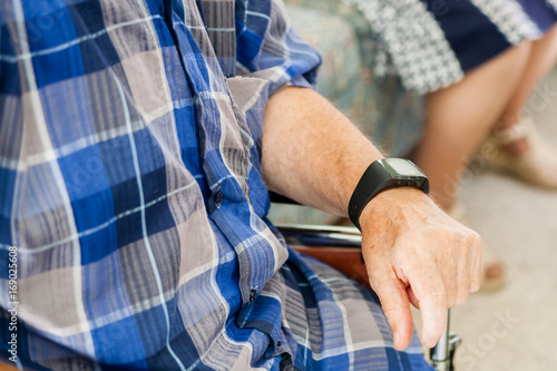Obraz na płótnie age, medicine, healthcare and people concept. close up of senior man hand with wearable device smart watch w salonie