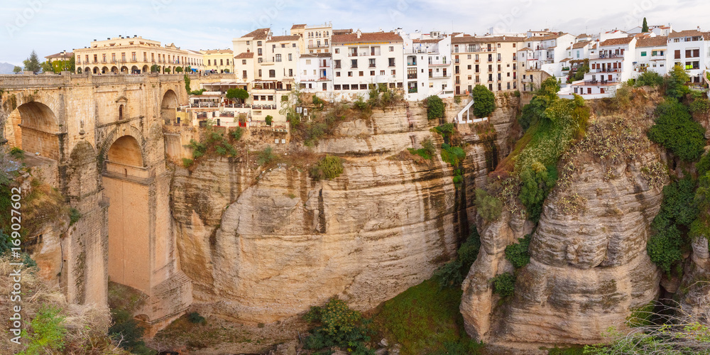 Panorama of Ronda, mountains and Puente Nuevo or New Bridge, over the Tajo Gorge, Andalusia, Spain
