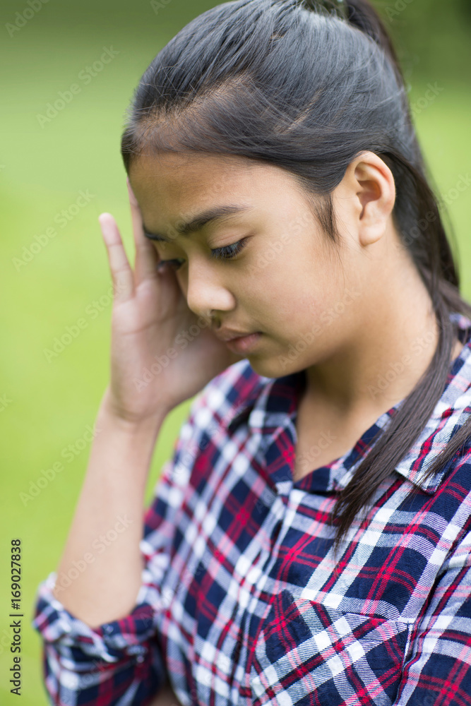 Outdoor Portrait Of Stressed Young Girl