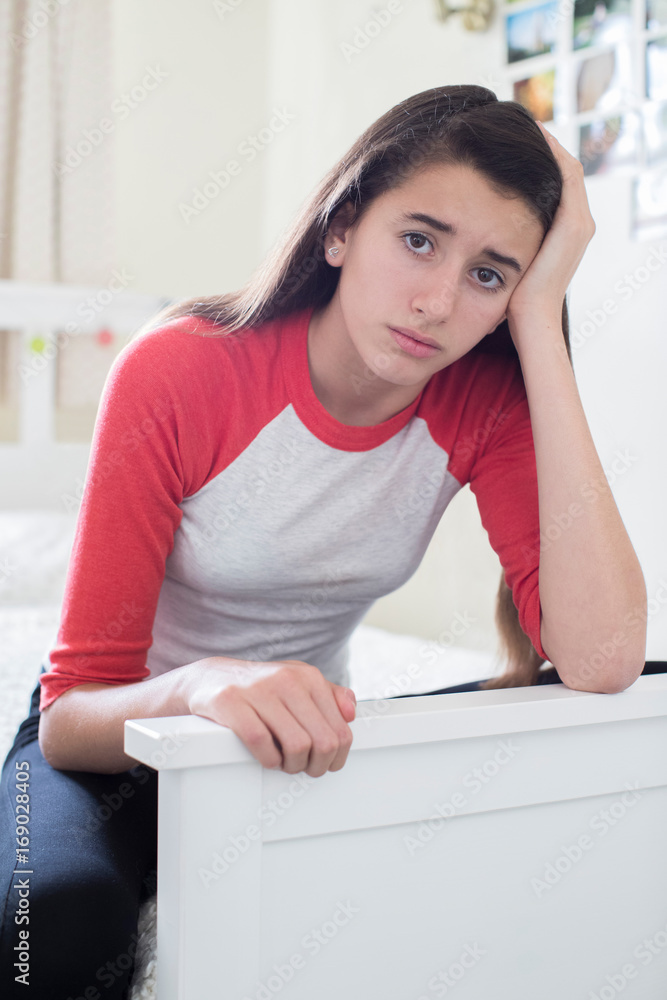 Portrait Of Stressed Teenage Girl In Bedroom Portrait Of Stressed Teenage Girl In Bedroom