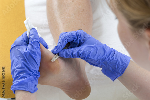 Woman receiving podiatry treatment in a Day Spa or in a podologist salon