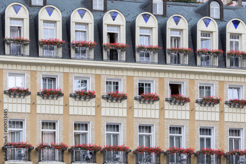 Karlovy Vary, Czech Republic - August 15, 2017:old condominiums flanked by the streets of the city, with a row of windows