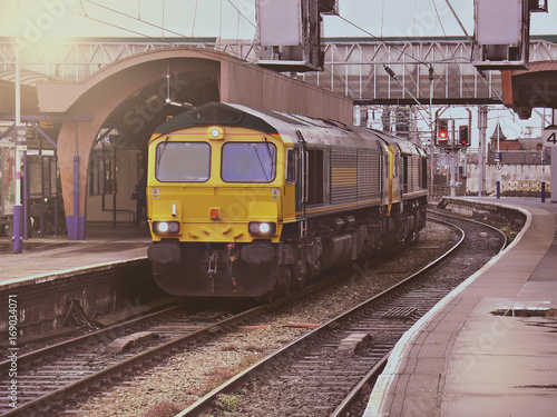 Freight train moves through the station.