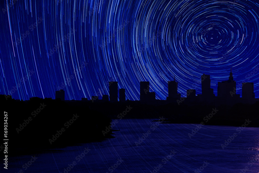 Photomontage panorama of Warsaw with flowing river and stars track