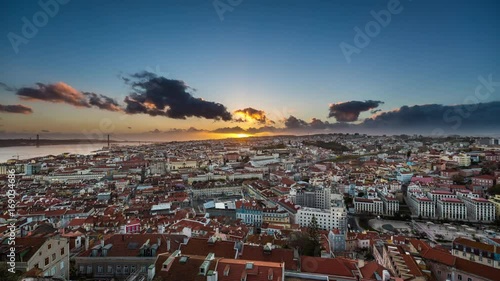 Amazing aerial sunset timelapse of sun rays over the Lisbon cityscape (Baixa district). Portugal. April, 2017 photo